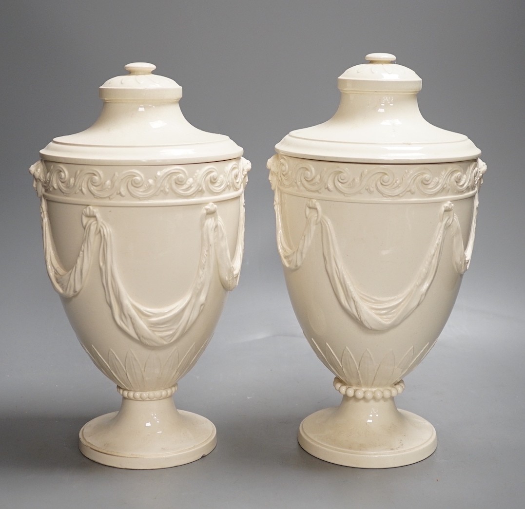 A pair of Wedgwood Etruria creamware vases and covers, c.1900, 28cm tall